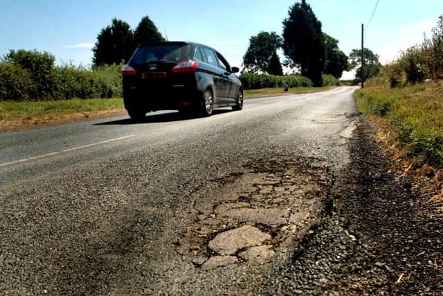A pot-holed stretch of the road leading into Long Clawson which Leicestershire County Council was due to investigate prior to carrying out extensive repairs following complaints by motorists EMN-190121-164628001