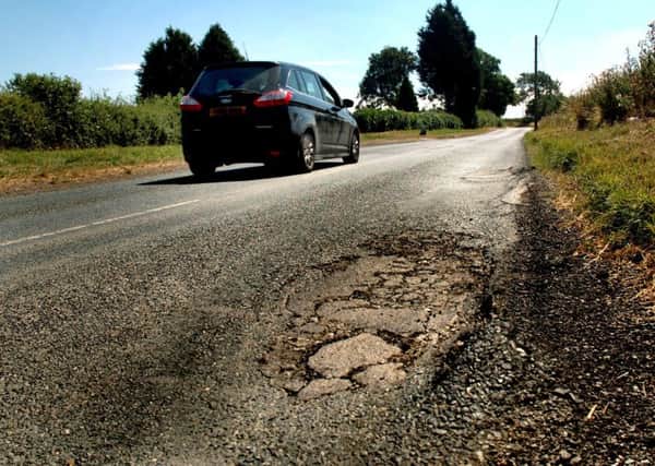 A pot-holed stretch of the road leading into Long Clawson which Leicestershire County Council was due to investigate prior to carrying out extensive repairs following complaints by motorists EMN-190121-164628001