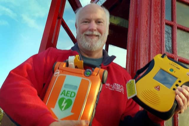 Martin Fagan, national secretary of the Community Heartbeat Trust, shows off one of the defibrillators the organisation installs around the borough EMN-190122-171813001