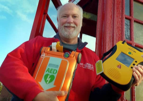 Martin Fagan, national secretary of the Community Heartbeat Trust, shows off one of the defibrillators the organisation installs around the borough EMN-190122-171813001