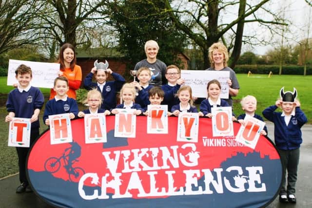Sarah Cobb (left), Jane Noad (centre) and Mrs Hopkins (right) with the children of Redmile Primary School PHOTO: Supplied