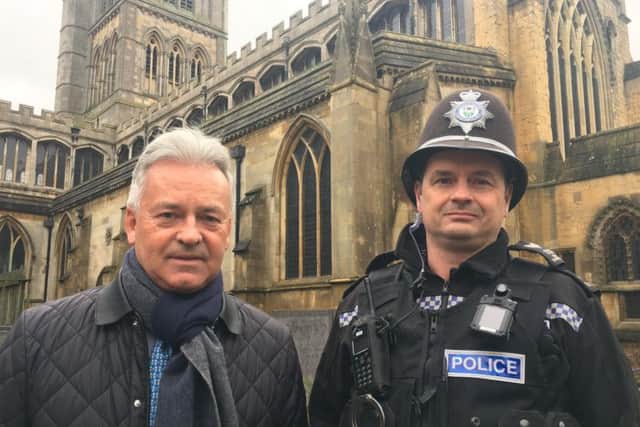 Melton MP Sir Alan Duncan pictured with Sgt Iain Wakelam, of Melton Police, outside St Mary's Church in the town this morning, as they discussed concerns over rising crime EMN-190125-135039001