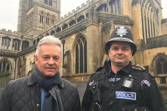Melton MP Sir Alan Duncan pictured with Sgt Iain Wakelam, of Melton Police, outside St Mary's Church in the town this morning, as they discussed concerns over rising crime EMN-190125-135039001