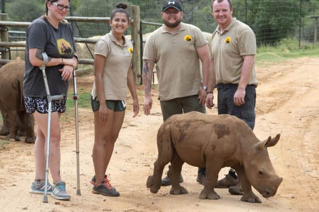The Veterans for Wildlife project at the Care for Wild Rhino Sanctuary near the Kruger National Park in South Africa - from the left Jennifer Yarwood, Jennifer Jessey, Chris Corbett and Pete Dunning 
pictured with orphaned rhino Arthur EMN-190131-133921001
