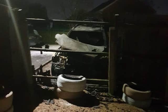 The charred remain of a family's car following an arson attack on it in a car park in Drummond Walk, Melton EMN-190402-101019001