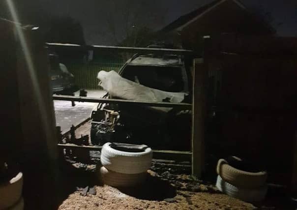 The charred remain of a family's car following an arson attack on it in a car park in Drummond Walk, Melton EMN-190402-101019001