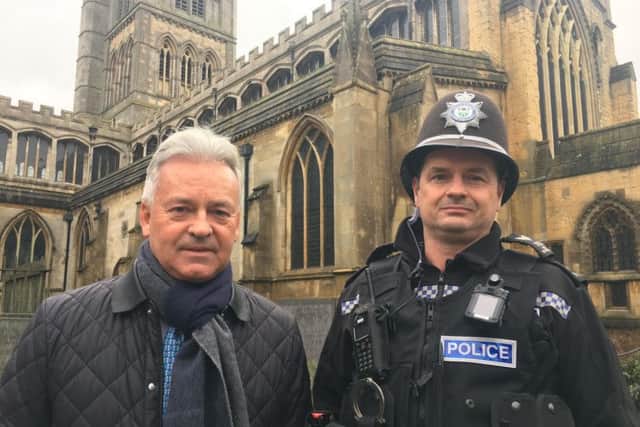 Melton MP Sir Alan Duncan pictured with Sgt Iain Wakelam, of Melton Police, outside St Mary's Church in the town as they discussed concerns over rising crime EMN-190502-180933001