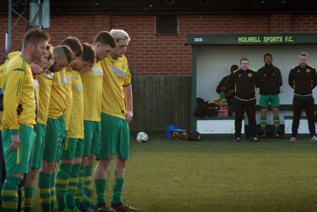Holwell Sports players line up for a minute's silence for Ian Wakefield ahead of Saturday's match with Aylestone Park EMN-191202-100358002
