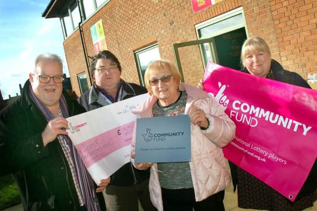 Andrew Lake and Colin Laws with Pam Posnett and Sarah Cox from Melton Learning Hub celebrating the new funding for full-time engagement officers to be based at The Venue. EMN-191202-173009001