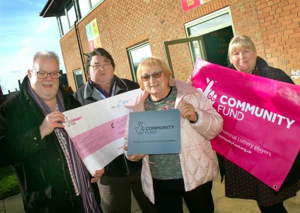 Andrew Lake and Colin Laws with Pam Posnett and Sarah Cox from Melton Learning Hub celebrating the new funding for full-time engagement officers to be based at The Venue. EMN-191202-173009001