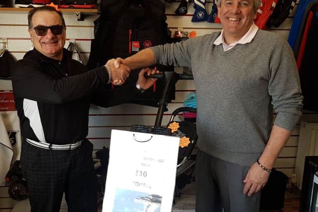 Club captain Gerry Stephens presents Owen Cook with his prize EMN-191202-183602002