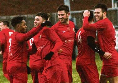 Co-manager Jon Stevenson (left), who made only his second Town start after injury, celebrates Parsons' opener