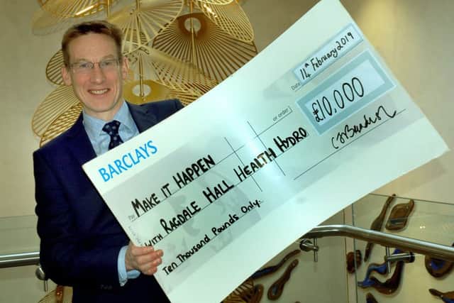 David Hamdorff of Ragdale Hall Spa shows off a cheque for the £10,000 community cash pot to be allocated for Make It Happen 2019 EMN-190213-111910001