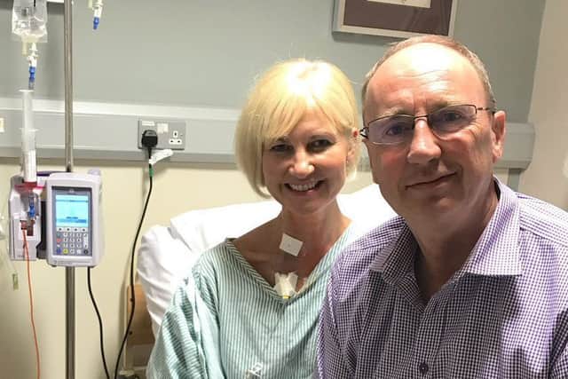 Emma Agnew pictured in hospital for her cancer treatment with husband Jonathan by her side EMN-190219-165951001