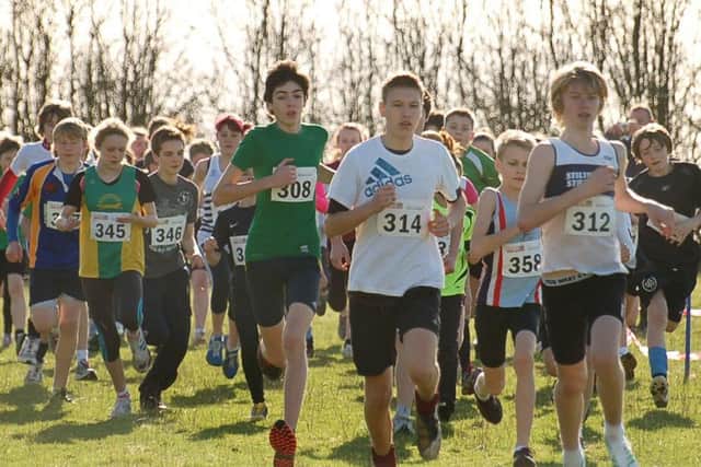 Thrussington Fun Run - the seniors and youth race competitors make their way to the brook crossing PHOTO: Tim Williams EMN-190219-180427002