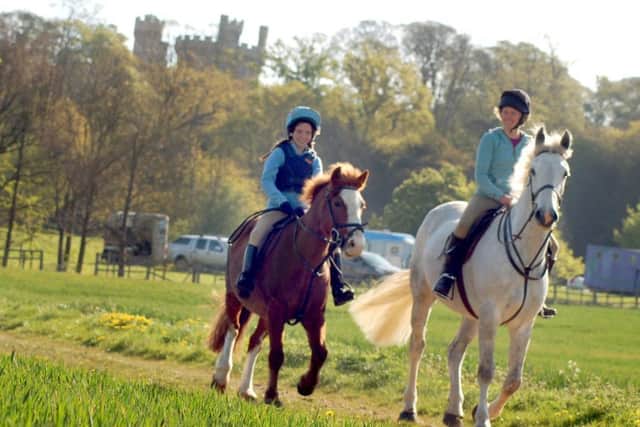 Riding through the Belvoir Castle estate PHOTO: Tim Williams