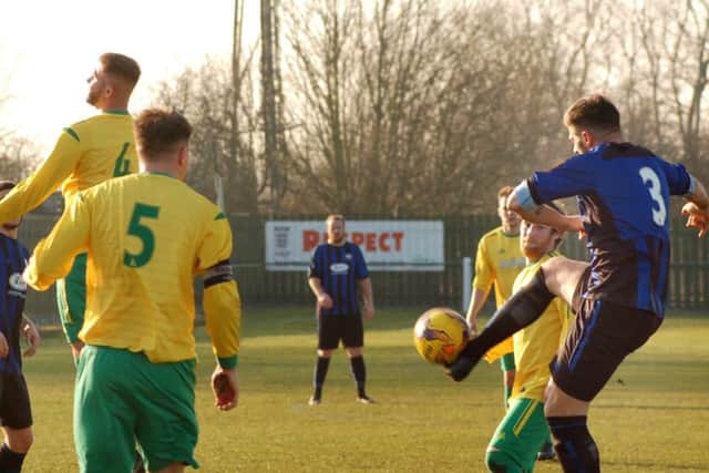 Former Melton Town player Edi Appleton lobs an equaliser for Burton Park EMN-190226-190944002
