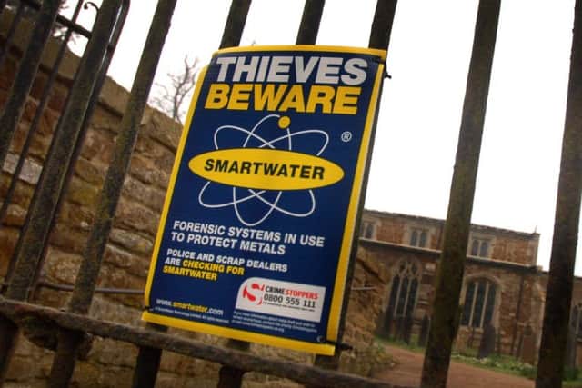 A crime safety poster outside St Denys Church. Goadby Marwood, which had its roof lead stripped by thieves EMN-190103-094152001