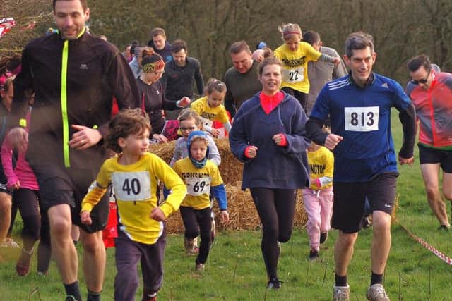 Parents lend a helping hand as the youngest fun runners tackle the Frisby course EMN-190313-093505002