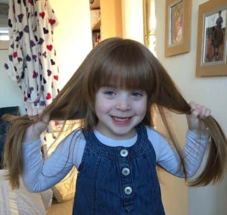 Olivia Fryer (3), who is helping the Little Princess Trust and Young Epilepsy charities by having her long hair cut EMN-190703-115524001