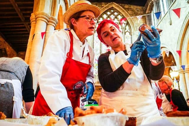 Judges check out an entry in the vegan pie class at the British Pie Awards in Melton this week EMN-190803-150632001