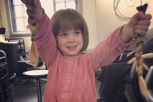 Melton girl Olivia Fryer (3) pictured after having her long hair cut off to donate it to the Little Princess Trust and to raise funds for the Young Epilepsy charity EMN-191103-102339001