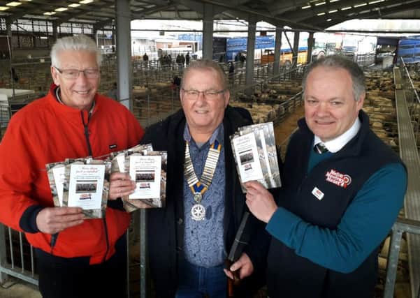 Hugh Brown (right), CEO of Melton Mowbray Market and founder of its operator Gillstream Markets, with local historian Derek Simmonds (left) and Jim Schofield, from Melton & Belvoir Rotary Club, holding the new 150th anniversary brochures EMN-191203-163357001