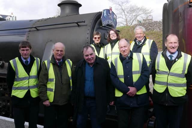 The late Nigel Dobbing (centre) with colleagues from The Railway Touring Company EMN-190314-100852001