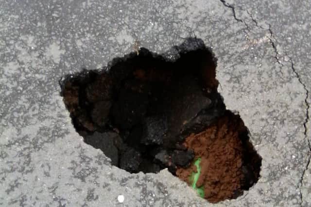 The large sink hole which has appeared in King Street, Melton EMN-190318-102446001