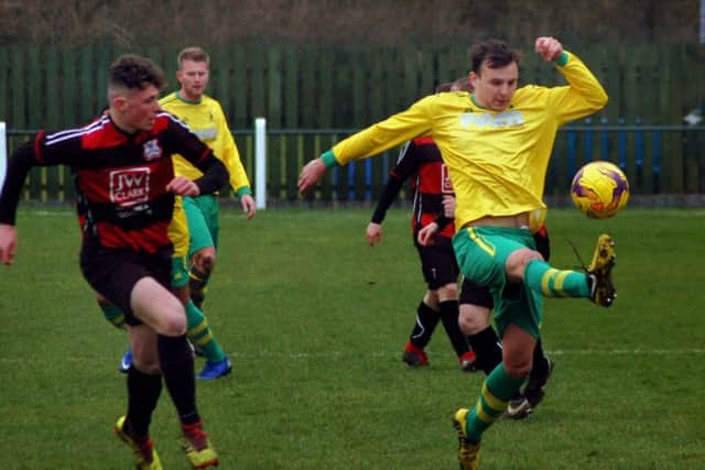 Connor O'Grady at full stretch against Raunds EMN-190320-090810002