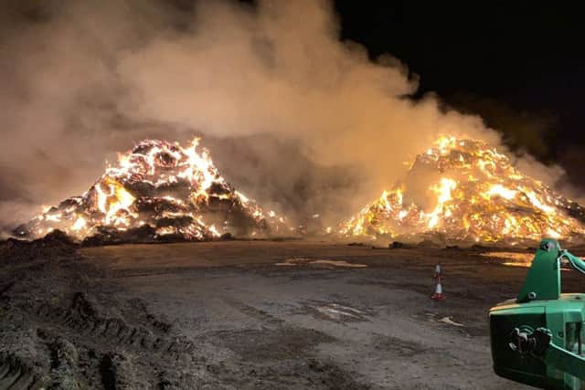 Firefighters tackle a huge stacks blaze involving straw and tyres at Saltby EMN-190320-091000001