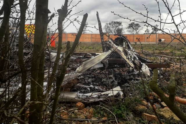 The charred remains of the caravans following a fire in field off Sandy Lane in Melton EMN-190319-141031001