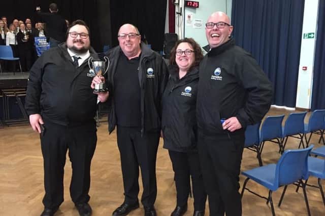 With the trophy are (left to right): Henry Dunger, Dennis Powell, Wendy Rid and Chris Shilam PHOTO: Supplied