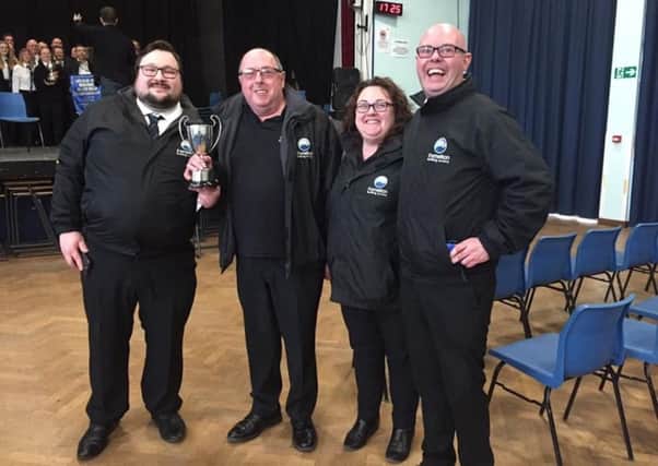 With the trophy are (left to right): Henry Dunger, Dennis Powell, Wendy Rid and Chris Shilam PHOTO: Supplied
