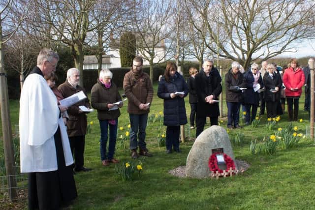 Villagers and members of Hose and Harby branch of the Royal British Legion at a service of dedication for a new war memorial stone at Barkestone-le-Vale EMN-190322-091822001