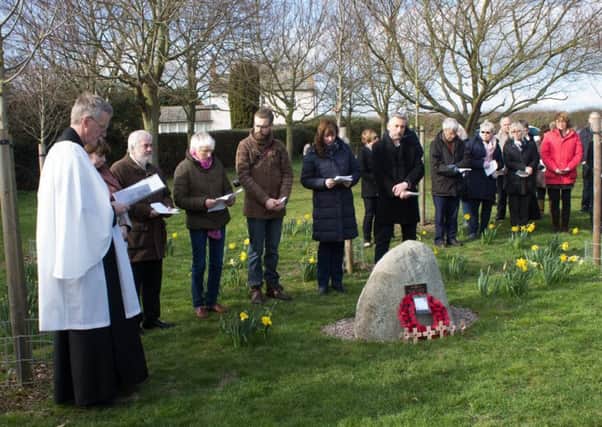 Villagers and members of Hose and Harby branch of the Royal British Legion at a service of dedication for a new war memorial stone at Barkestone-le-Vale EMN-190322-091822001
