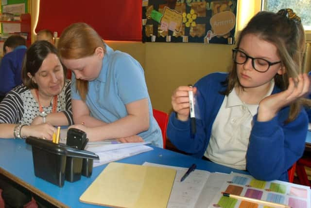 Teacher Monika Tyler with year six pupils at The Grove Primary School in Melton EMN-190326-111424001