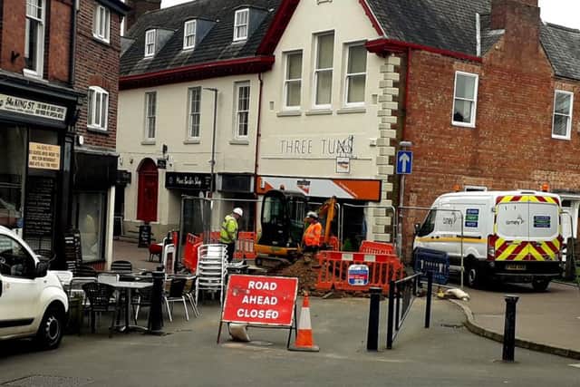 Workmen continue to work on the collapsed sewer which caused a sinkhole to open in King Street in Melton EMN-190326-133353001