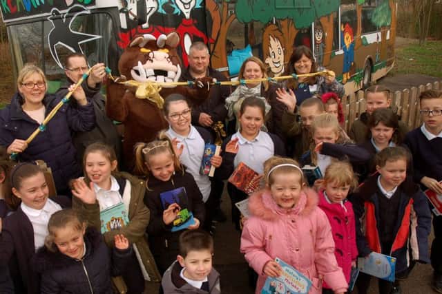 Gruffalo cuts the ribbon with PTA (SWAF), assistant headteacher Gail Edwards and children from various classes PHOTO: Tim Williams