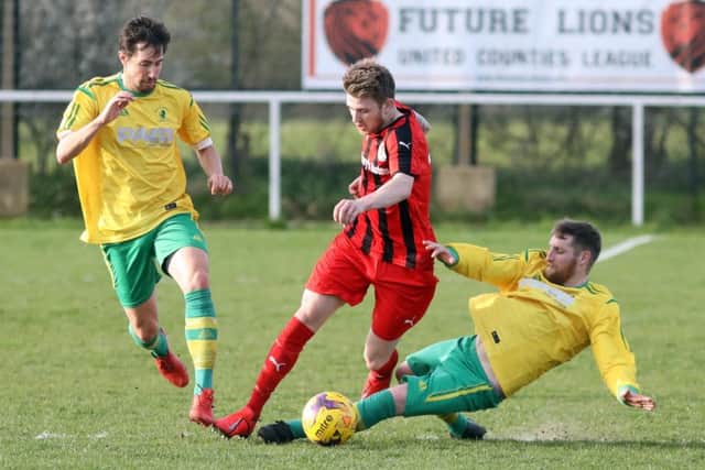 David Hazeldine, in at full-back, puts in a timely challenge EMN-190327-132052002