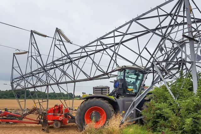 Fortunately, the driver of this agricultural vehicle escaped unhurt when his
tractor crashed into a pylon while using autosteer near Grantham
©Adam O"Sullivan-- EMN-190104-151212001