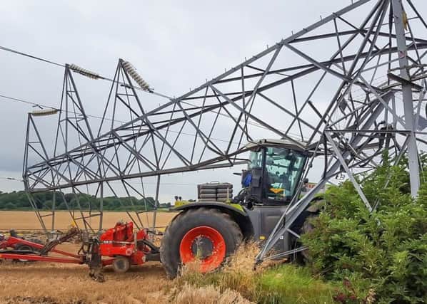 Fortunately, the driver of this agricultural vehicle escaped unhurt when his
tractor crashed into a pylon while using autosteer near Grantham
©Adam O"Sullivan-- EMN-190104-151212001