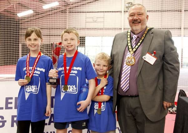 Ab Kettleby Primary School's new age kurling winners with Leicestershire County Council chairman Ozzy O'Shea EMN-190304-105623002