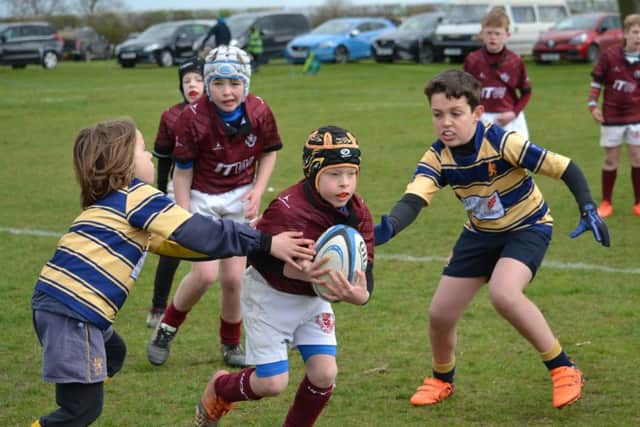 Ford battles through the defence in a great day for Melton RFC U9s EMN-190304-140724002