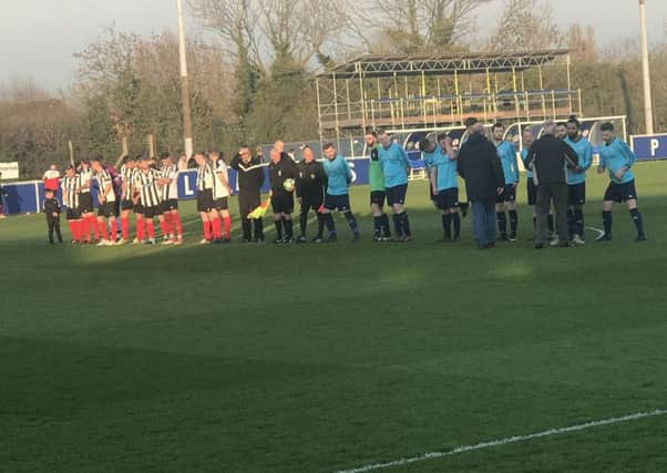 Wymeswold FC Reserves (in blue) and Cosby line up before kick-off. Picture: Leicestershire and Rutland FA EMN-190404-144030002