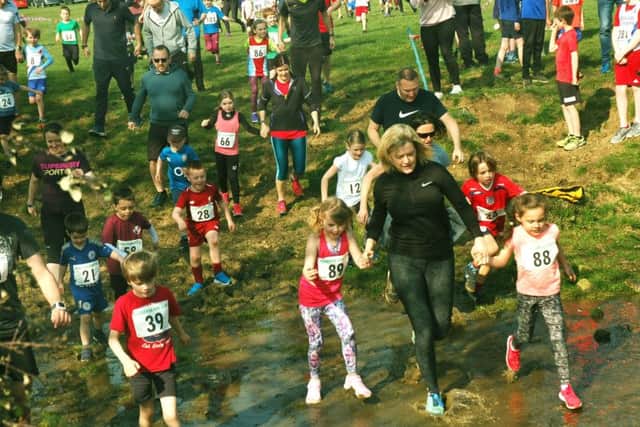 The Pre-school and Reception race reaches the water crossing EMN-190404-155041002