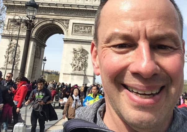 A selfie taken by Andrew Wrath in front of the Arc de Triomphe during his run through Paris during his 50km charity running challenge in aid of Hope for Justice EMN-190804-120402001