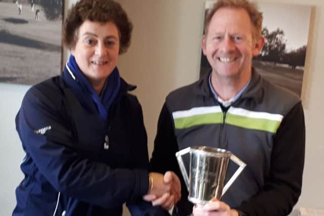 Lady captain Nancy Denny presents overall winner Paul Gough with the Autumn Trophy EMN-190904-094455002