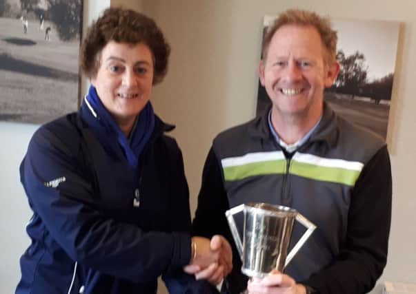 Lady captain Nancy Denny presents overall winner Paul Gough with the Autumn Trophy EMN-190904-094455002