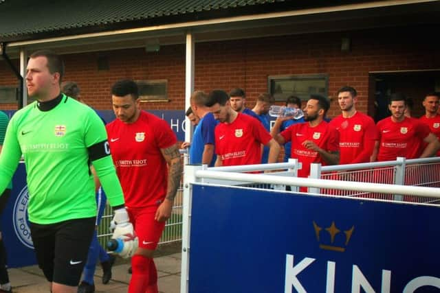 Rob Peet leads Town out of the Holmes Park changing rooms before kick-off EMN-191004-090513002